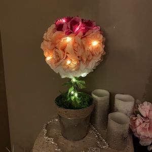rose pomander centerpiece with glowing lights.